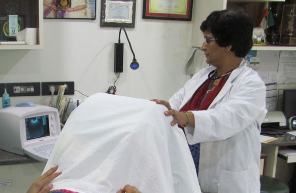 Dr. Jyoti Bhaskar Examining the Patient